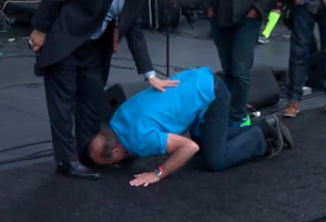 Lou Engle kissing the feet of a Pope Benedict appointee. (screenshot courtesy Herescope)